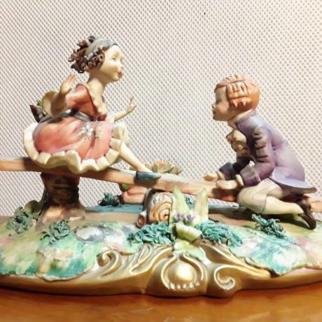 (22) (CK20022) Capodimonte Porcelain Figurine. (Children On The See Saw). Made in Italy.75.00 euros.